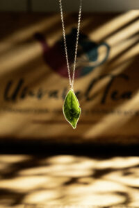 photo tea leaf necklace in dappled warm light